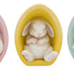 Baby bunny in egg figurine